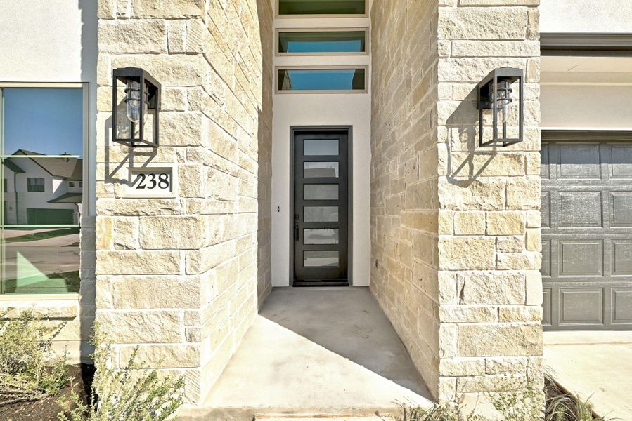 Exterior details and patio area of a home in The Colony, Bastrop (Image 21).