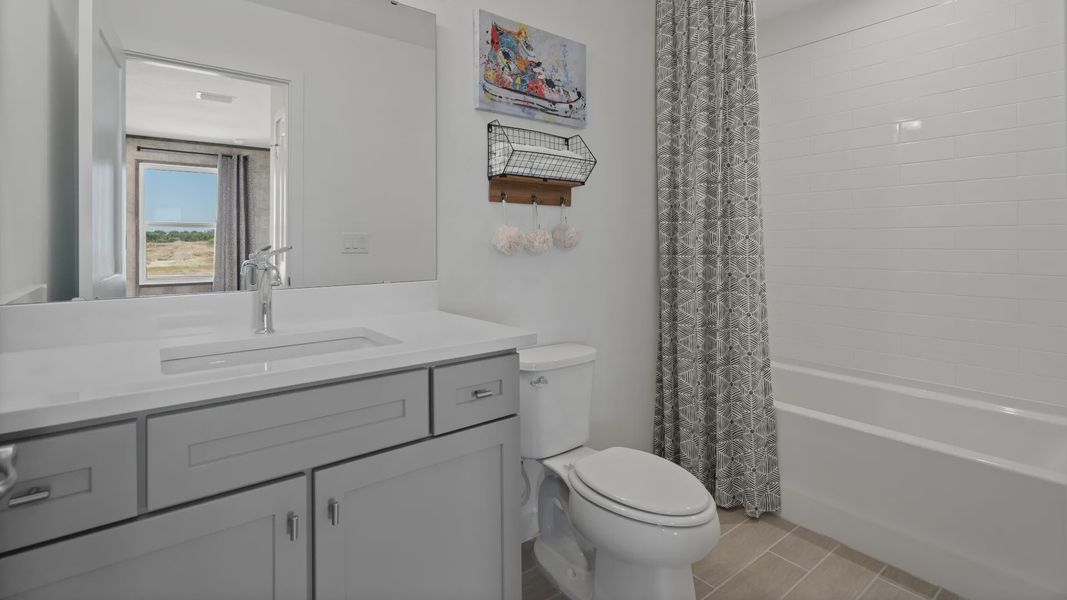 Above garage retreat full bathroom in a DRB Homes Ambersweet model at the Trinity Place community. Above garage retreat full bathroom in a DRB Homes Ambersweet model at the Trinity Place community.