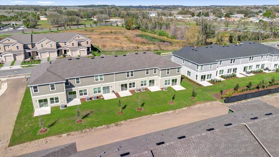 Front exterior of a new home in Reserve at Forest Lake Townhomes, Lake Wales, FL, highlighting curb appeal (Image 16).