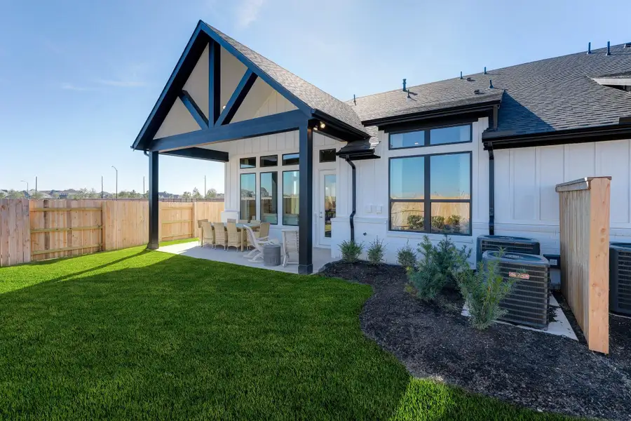 Front exterior of a new home in Elyson: Elyson Duets, Katy, TX, highlighting curb appeal (Image 1). Front exterior of a new home in Elyson: Elyson Duets, Katy, TX, highlighting curb appeal (Image 1).