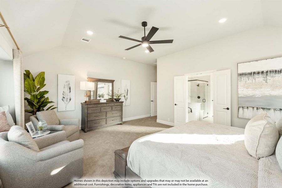 Master bedroom with vaulted ceiling, ceiling fan, carpet flooring, sitting area, and ensuite bathroom access