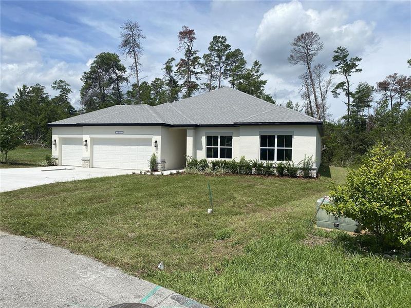 Front exterior of a new home in , Brooksville, FL, highlighting curb appeal (Image 18).