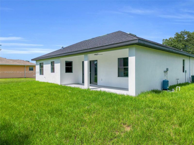 Front exterior of a new home in , Lehigh Acres, FL, highlighting curb appeal (Image 18). Front exterior of a new home in , Lehigh Acres, FL, highlighting curb appeal (Image 18).