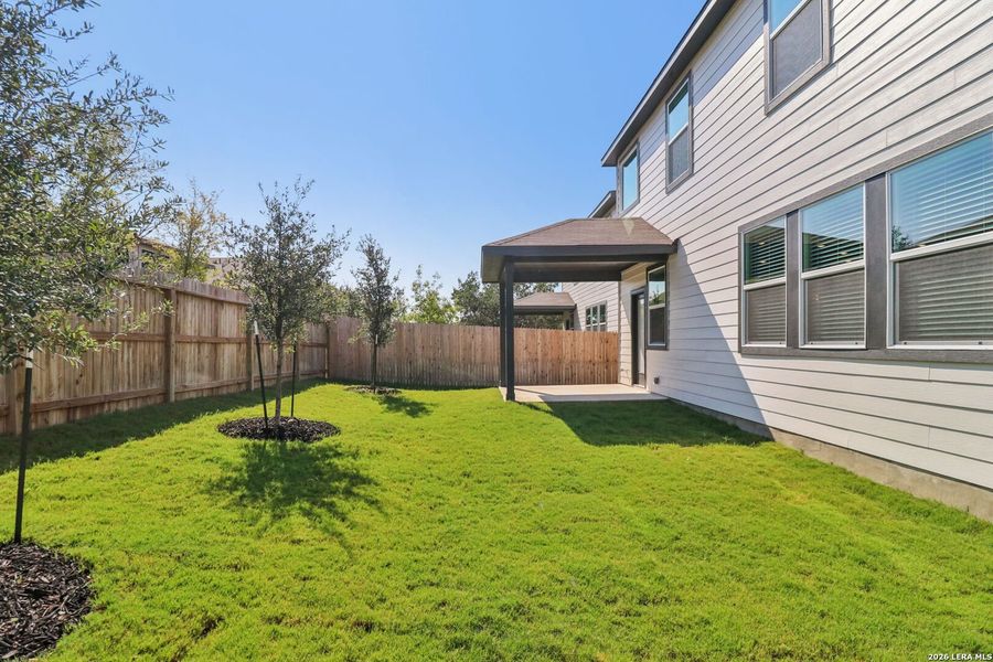Exterior details and patio area of a home in Thomas Pond, San Antonio (Image 32).
