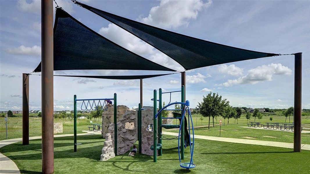 Community playground featuring a yard