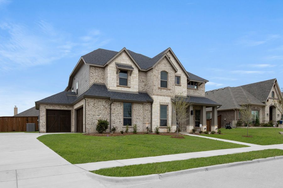 Front exterior of a new home in Hayes Crossing, Midlothian, TX, highlighting curb appeal (Image 2). Front exterior of a new home in Hayes Crossing, Midlothian, TX, highlighting curb appeal (Image 2).