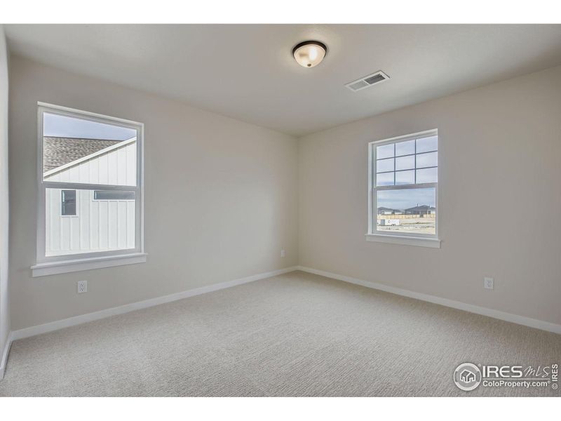 Spacious, unfurnished interior of a new home in RainDance National 60/70, Windsor (Image 24).