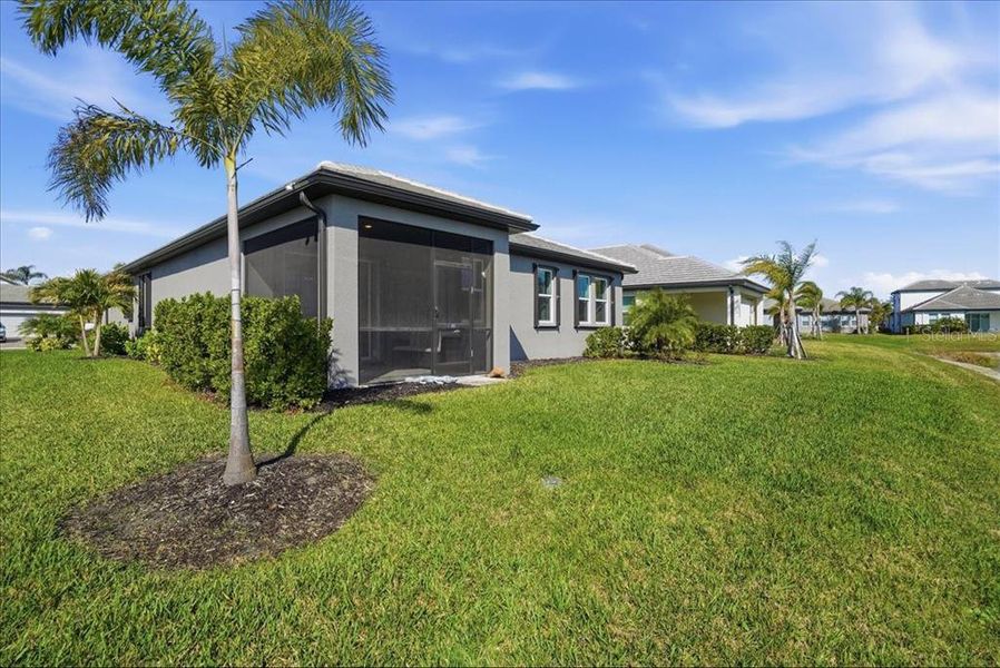 Exterior details and patio area of a home in Cypress Glen at River Wilderness, Parrish (Image 26).
