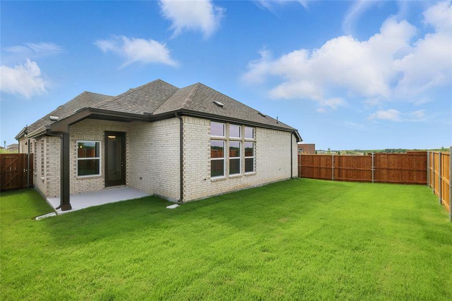 Back of house featuring a patio, brick siding, and a shingled roof Back of house featuring a patio, brick siding, and a shingled roof