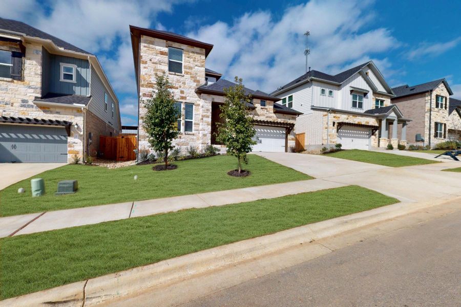 Front exterior of a new home in Edgewood, Leander, TX, highlighting curb appeal (Image 2).