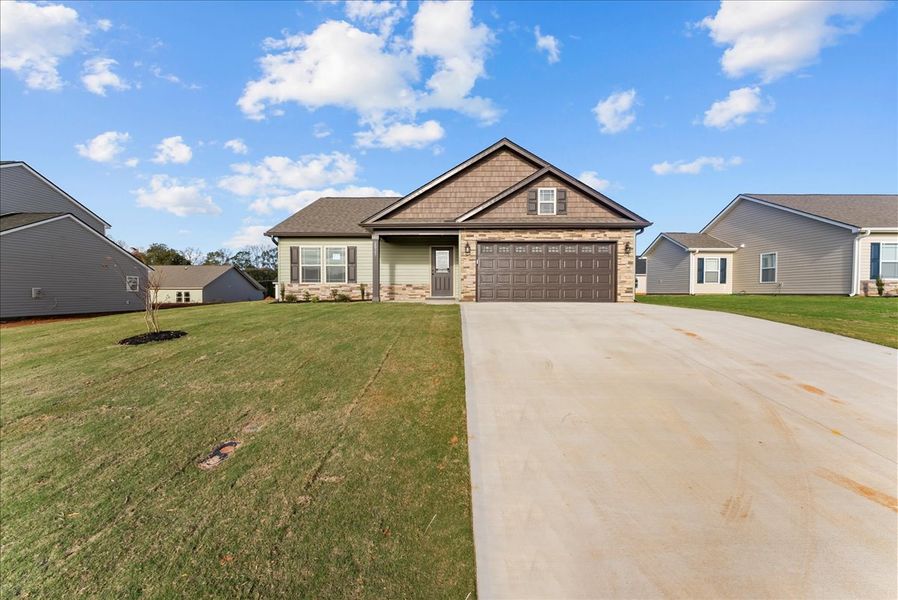 Representative exterior photo of a completed home built from the Rozlynn by Enchanted Homes in Guadalupe Heights, Seguin, TX (Image 25).