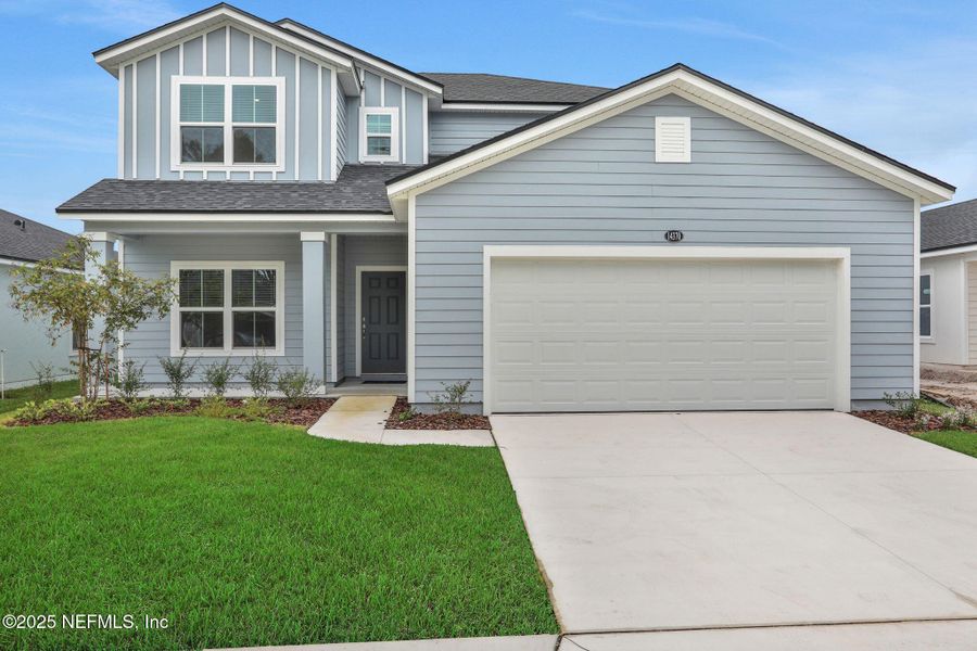 Front exterior of a new home in Bellbrooke, Jacksonville, FL, highlighting curb appeal (Image 1).