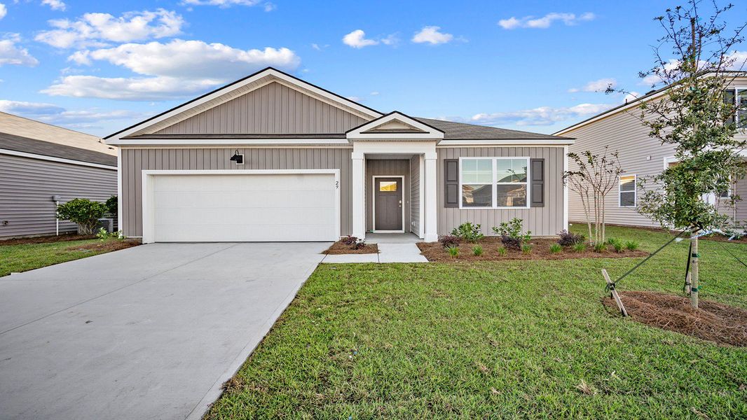 Front exterior of a new home in Palm Ridge, Guyton, GA, highlighting curb appeal (Image 1). Front exterior of a new home in Palm Ridge, Guyton, GA, highlighting curb appeal (Image 1).