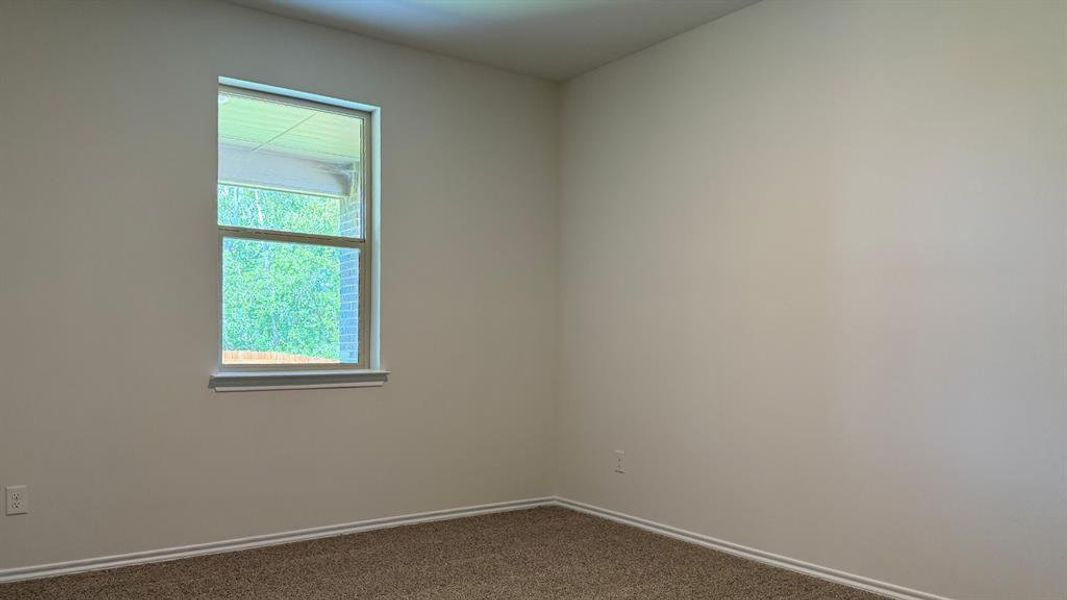 Room featuring neutral wall paint, white trim, and light brown carpet Room featuring neutral wall paint, white trim, and light brown carpet