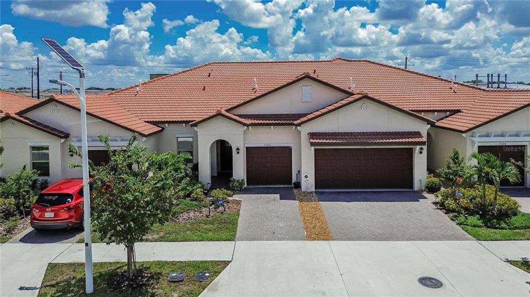 Front exterior of a new home in Southshore Bay Active Adult, Wimauma, FL, highlighting curb appeal (Image 33).