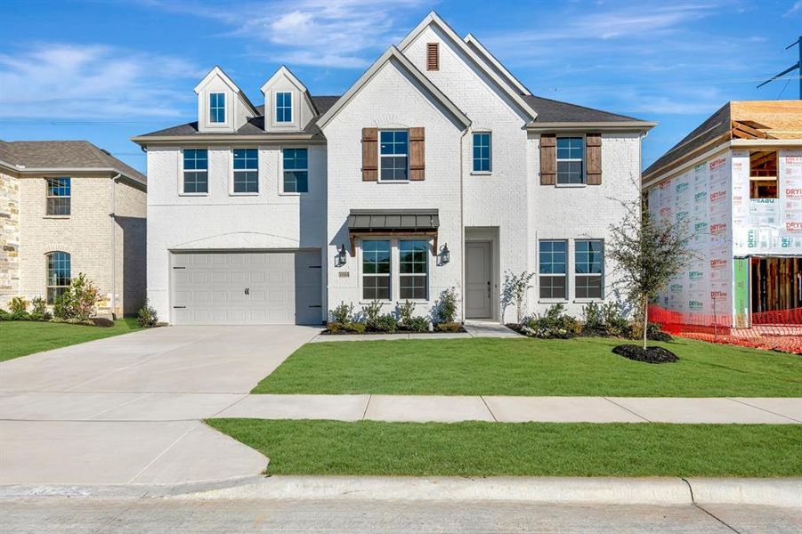 Front exterior of a new home in Wellington, Fort Worth, TX, highlighting curb appeal (Image 1).