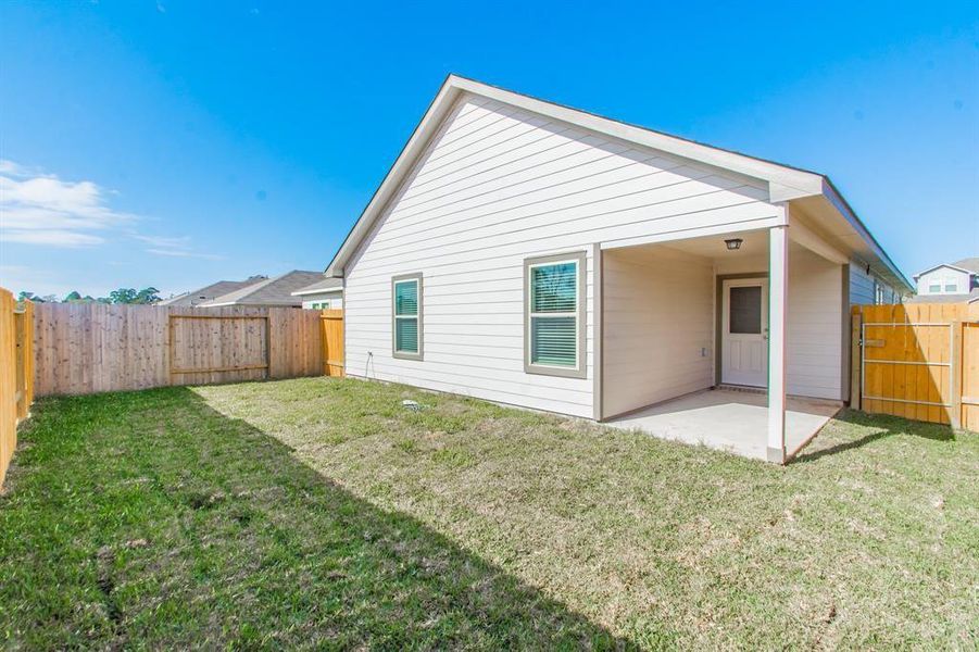 This fully fenced backyard offers privacy and plenty of room to play, garden, or entertain. The covered patio adds a shaded retreat for relaxation, while the surrounding space invites endless possibilities for outdoor activities.