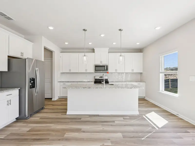 Furnished interior view inside a new home in Moss Farms, Lula (Image 4).