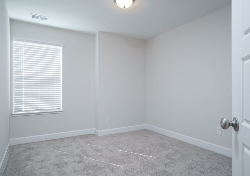 Representative unfurnished interior of a home built from the The Kennedy by Cothran Homes in Holly Ridge, Greenville (Image 34).