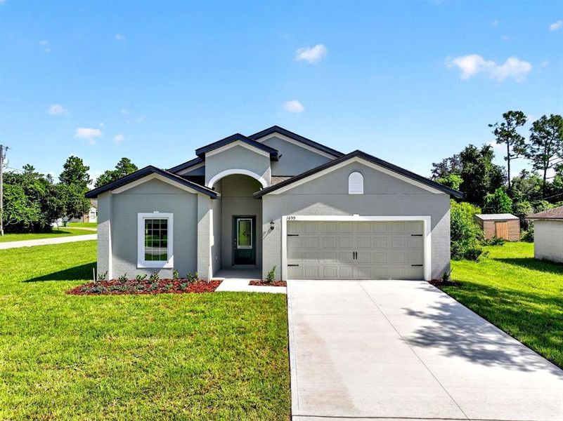 Front exterior of a new home in , Deltona, FL, highlighting curb appeal (Image 2). Front exterior of a new home in , Deltona, FL, highlighting curb appeal (Image 2).