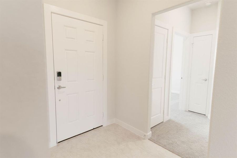 View of carpeted foyer