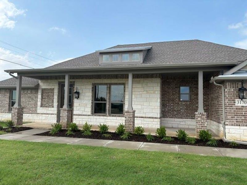 Front exterior of a new home in , Van Alstyne, TX, highlighting curb appeal (Image 23). Front exterior of a new home in , Van Alstyne, TX, highlighting curb appeal (Image 23).