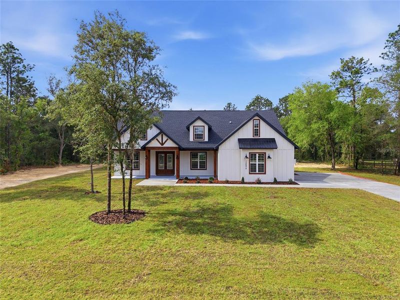Front exterior of a new home in , Dunnellon, FL, highlighting curb appeal (Image 2). Front exterior of a new home in , Dunnellon, FL, highlighting curb appeal (Image 2).