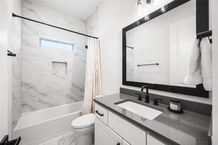 2nd bathroom located near the 2nd bedroom and study.