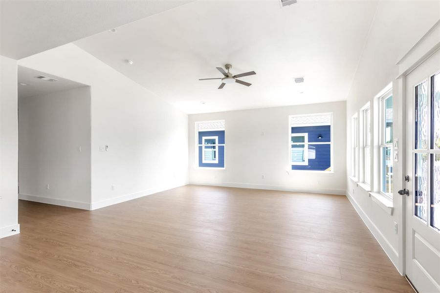 Vaulted living area with abundant natural light.