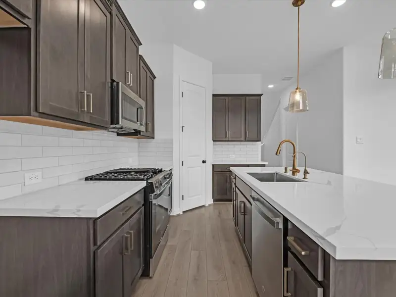 Kitchen. Sample product photo. Actual exterior and interior selections may vary by homesite. Photo may be virtually staged. Kitchen. Sample product photo. Actual exterior and interior selections may vary by homesite. Photo may be virtually staged.