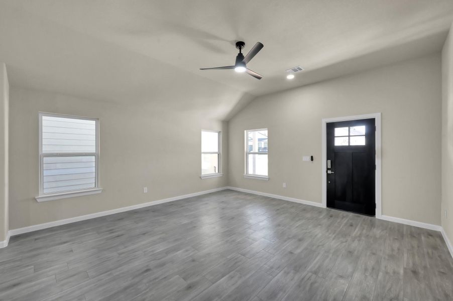 Bask in the airy feel of this contemporary layout, where high ceilings and oversized windows create an inviting atmosphere for everyday living.