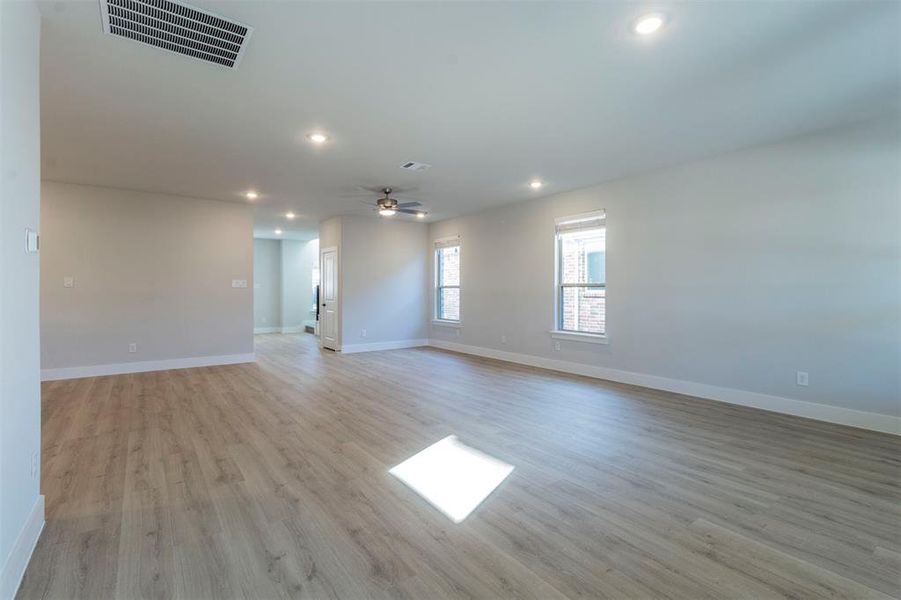 Spare room featuring light wood-style floors, recessed lighting, and ceiling fan