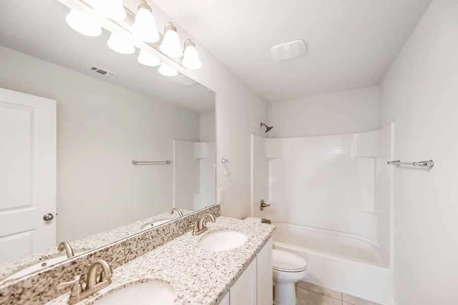 Representative exterior photo of a completed home built from the Marion by Impression Homes in Heartland, Heartland, TX (Image 23). Representative exterior photo of a completed home built from the Marion by Impression Homes in Heartland, Heartland, TX (Image 23).