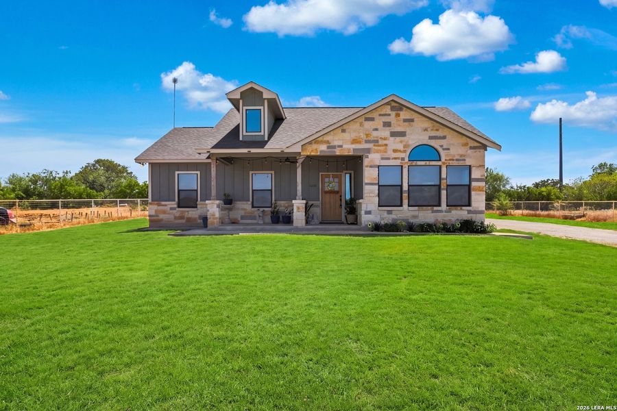 Front exterior of a new home in , Von Ormy, TX, highlighting curb appeal (Image 22).