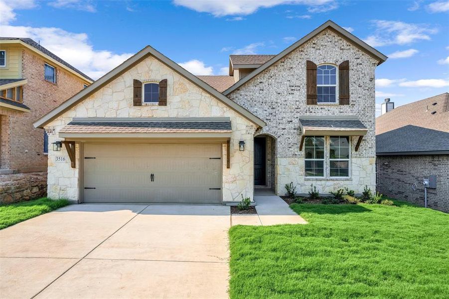 Front exterior of a new home in Liberty Pointe, Gainesville, TX, highlighting curb appeal (Image 23). Front exterior of a new home in Liberty Pointe, Gainesville, TX, highlighting curb appeal (Image 23).