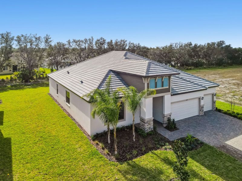 Front exterior of a new home in River Preserve Estates, Parrish, FL, highlighting curb appeal (Image 34).