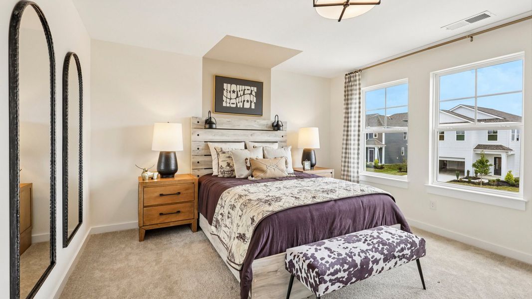 Secondary bedroom with carpet, closet, and window Secondary bedroom with carpet, closet, and window