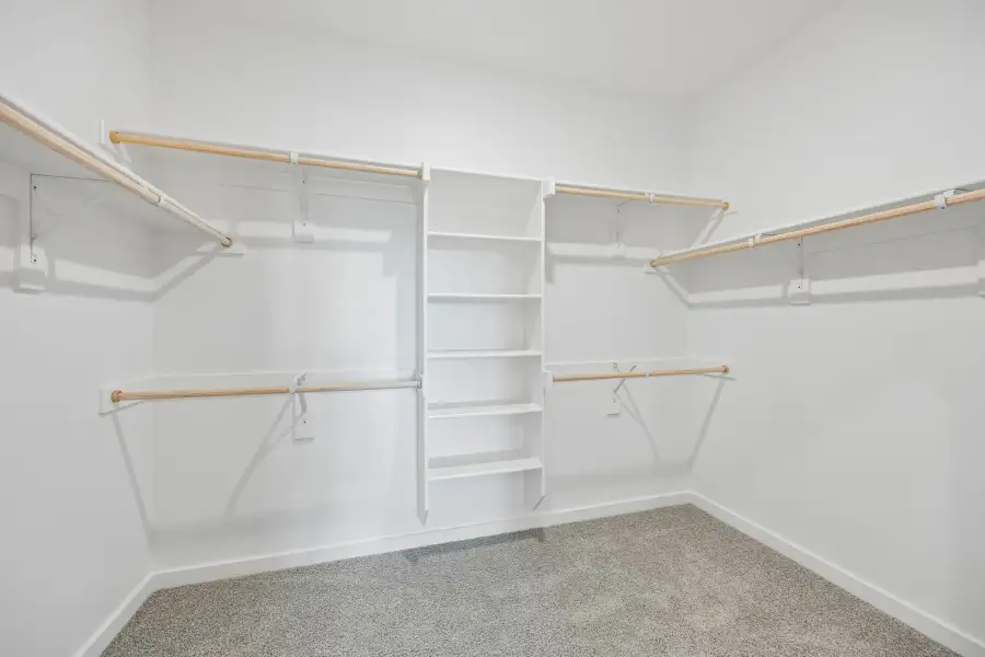 Primary Closet in the Mesquite home plan by Trophy Signature Homes – REPRESENTATIVE PHOTO Primary Closet in the Mesquite home plan by Trophy Signature Homes – REPRESENTATIVE PHOTO