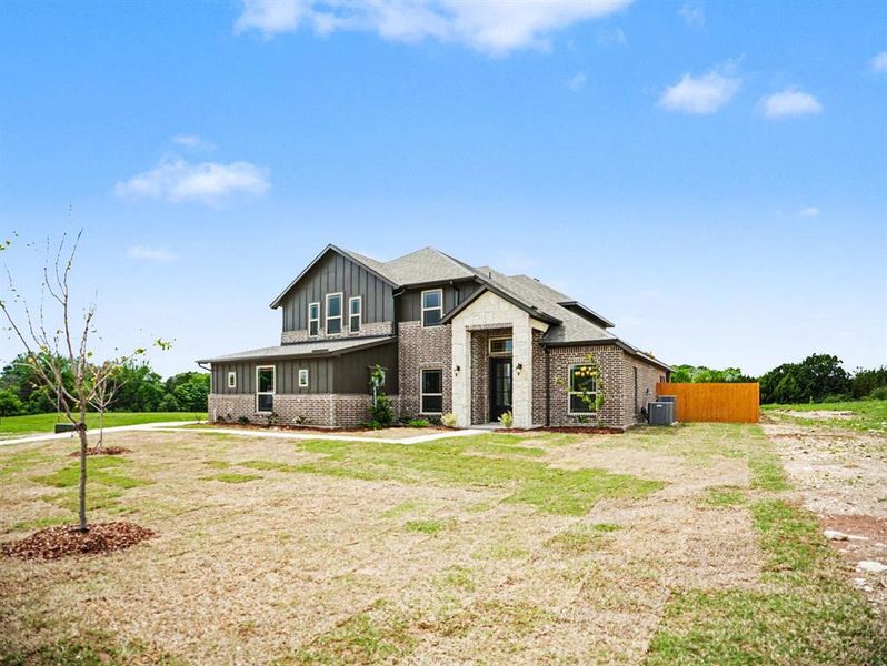 Front exterior of a new home in Ten Mile Creek Estates, DeSoto, TX, highlighting curb appeal (Image 17). Front exterior of a new home in Ten Mile Creek Estates, DeSoto, TX, highlighting curb appeal (Image 17).