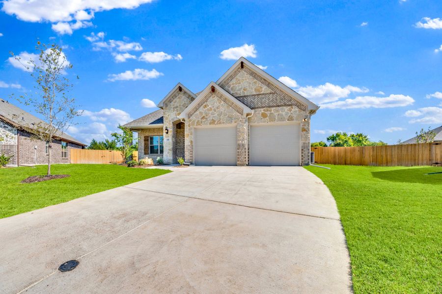 Front exterior of a new home in Summerwood, Red Oak, TX, highlighting curb appeal (Image 19).