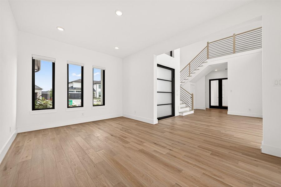 The formal dining room is generously sized and perfectly positioned off the entry, offering beautiful views of both the front grounds and the resort-style backyard. Every corner of this home was thoughtfully designed to showcase spectacular views.