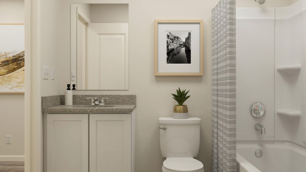A bathroom with a toilet and a sink.