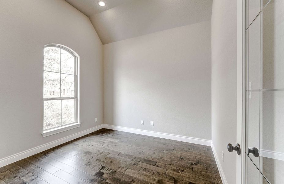 Representative unfurnished interior of a home built from the 3799 by Ravenna Homes in Artavia 70′, Conroe (Image 23).
