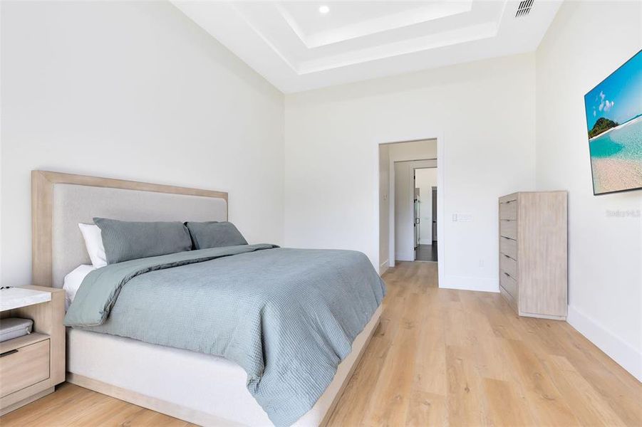 A peaceful haven with a double tray ceiling adding a unique architectural element.