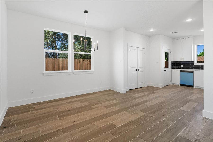 With the large windows and abundance of sunlight make this beautiful dinning area bright and inviting. A modern light fixture makes the space feel warm and welcoming, whether you’re enjoying casual family dinners or hosting friends for the evening. With its easy flow into the kitchen, it’s a space made for connection.