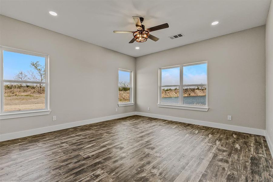Primary Bedroom with inset lighting and ceiling fan. Ensuite Bath.
