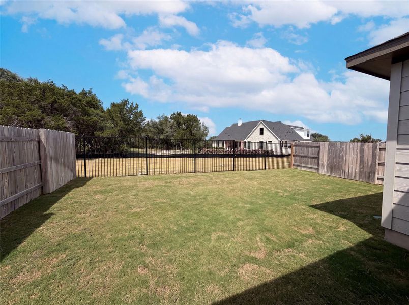 A well-maintained fenced yard offers ample space for outdoor enjoyment. A well-maintained fenced yard offers ample space for outdoor enjoyment.