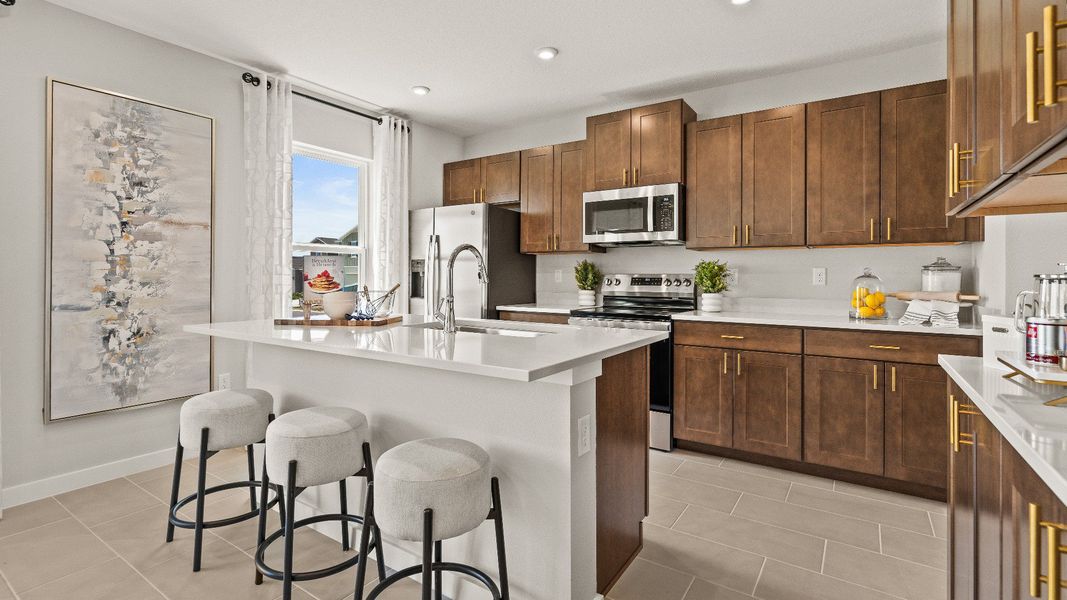 The Kitchen and Island in Model Highbourne by DRB Homes in Hamilton Bluff located in Haines City, FL. The Kitchen and Island in Model Highbourne by DRB Homes in Hamilton Bluff located in Haines City, FL.