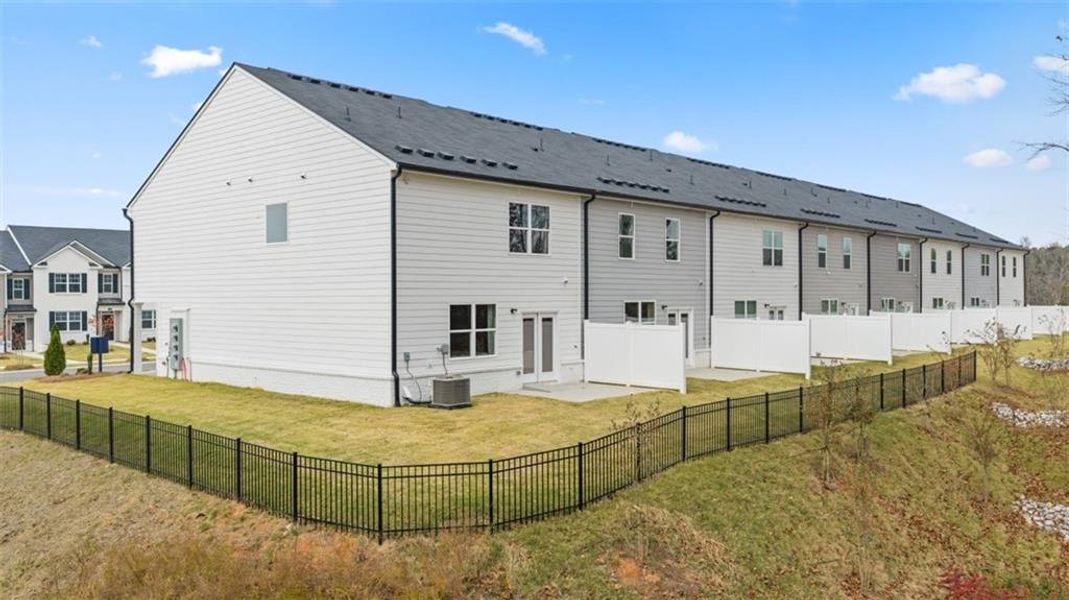 Exterior details and patio area of a home in Echo Glen, Stockbridge (Image 4).