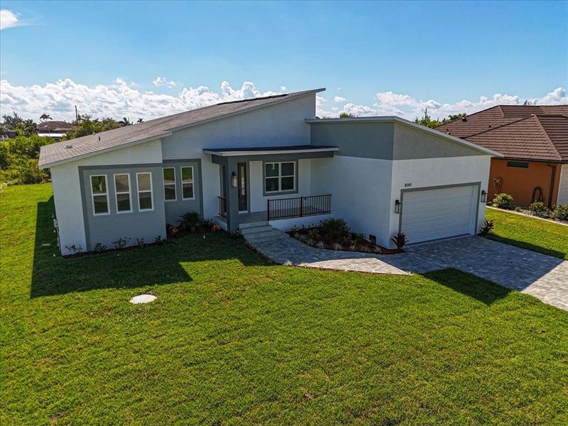 Front exterior of a new home in , Port Charlotte, FL, highlighting curb appeal (Image 20).